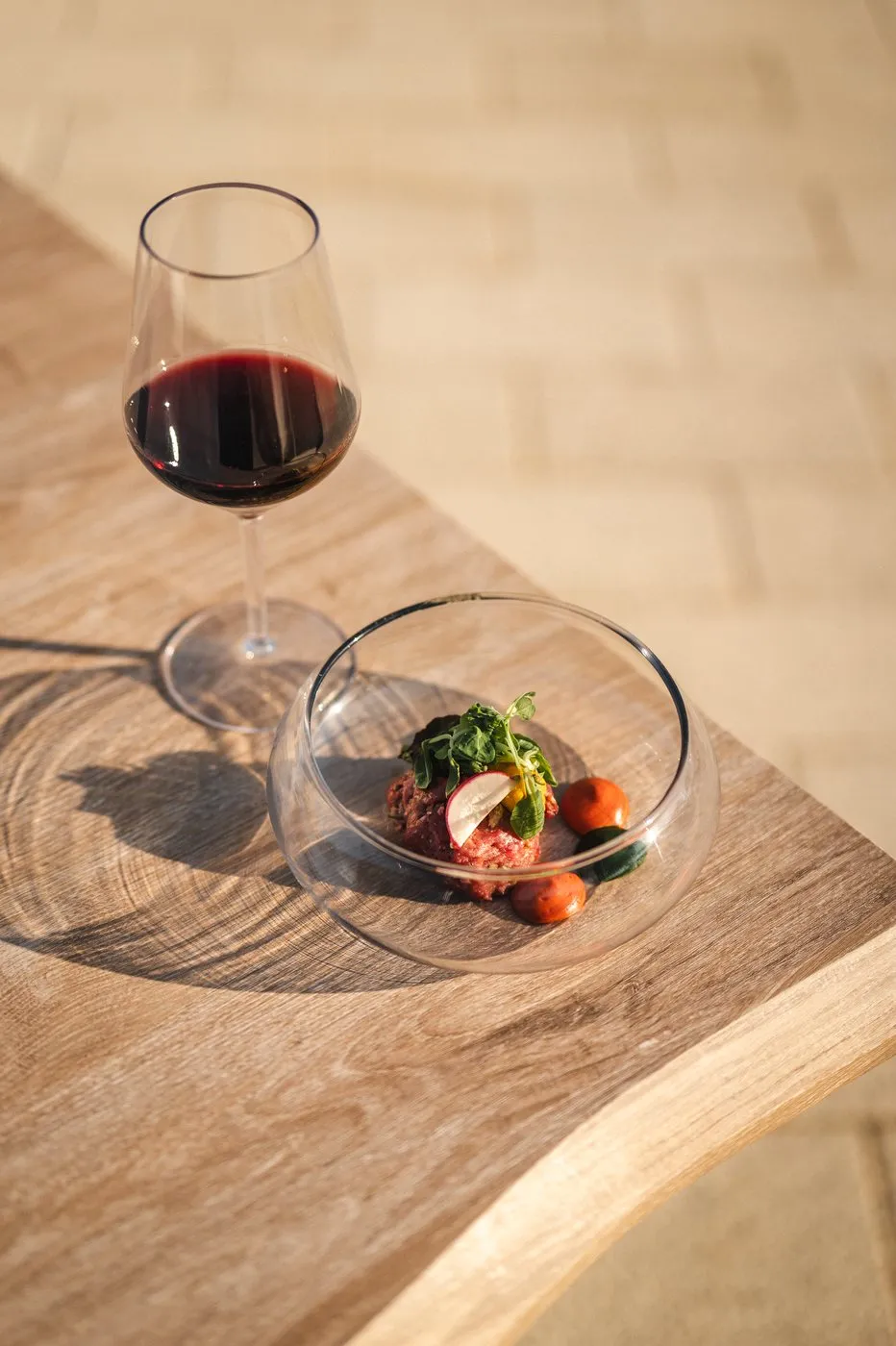 A glass of wine with tapas